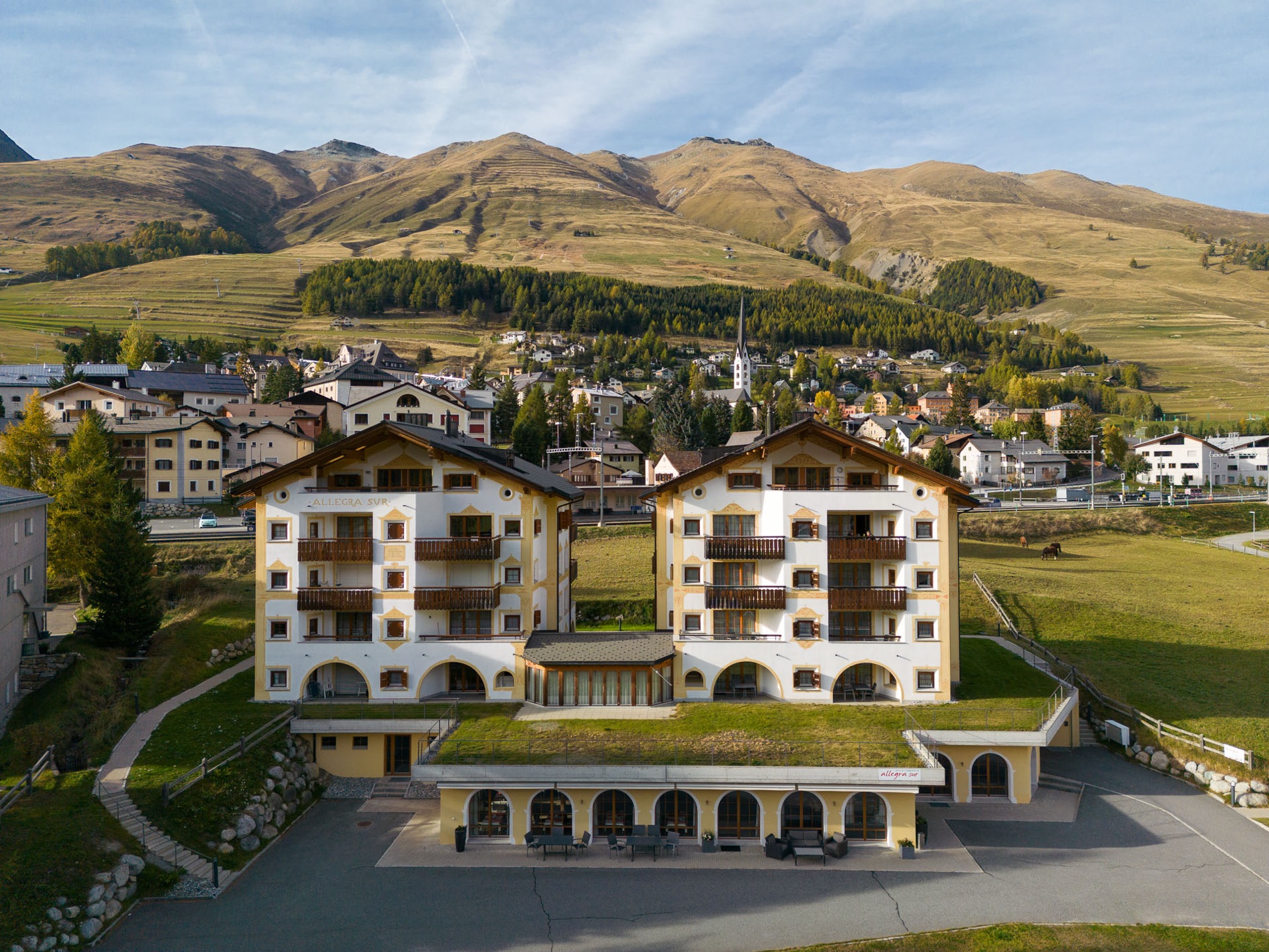 Hotel Allegra above the meadows in summer.